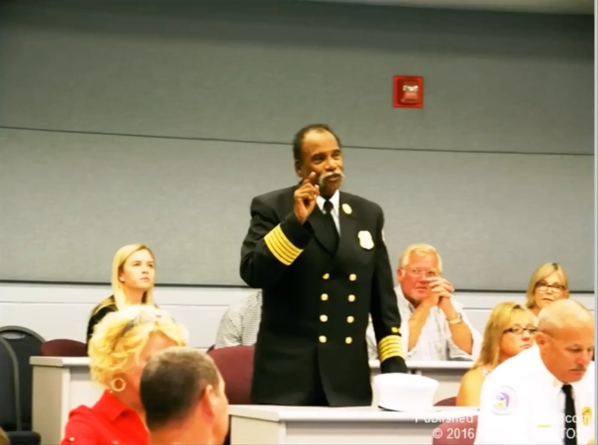 Military officer in dress uniform speaks to audience during 2015 conference panel discussion